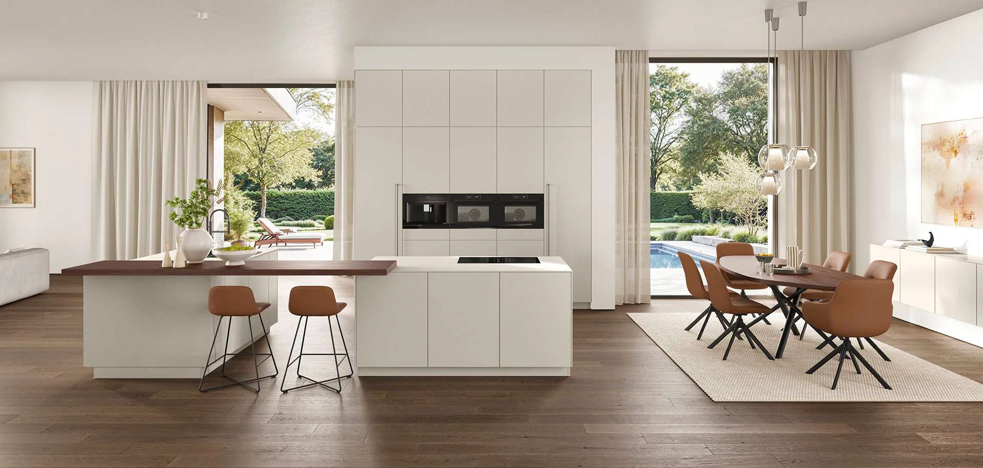 Helle Designküche mit weißer Front, Kochinsel mit Holztheke und Essbereich vor großer Fensterfront.