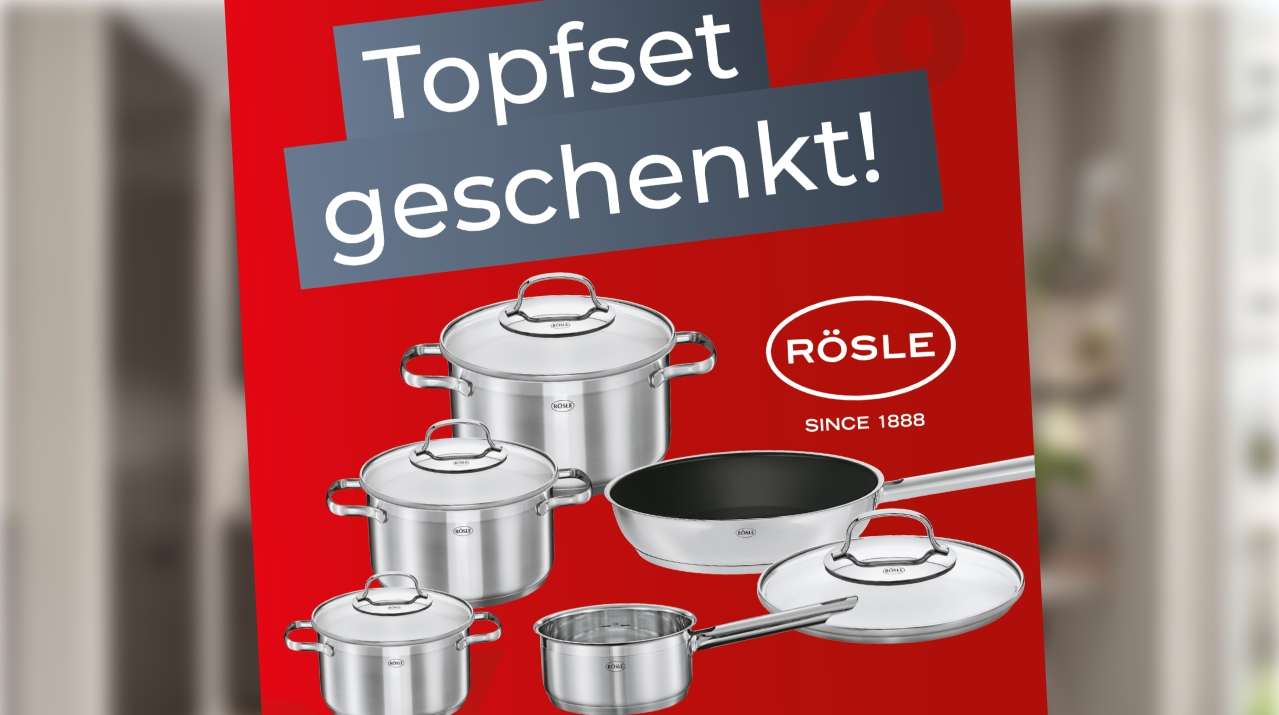 Rotes Werbeplakat mit einem silbernen RÖSLE-Topfset und dem Hinweis auf ein kostenloses Topfset ab Einkaufswert.