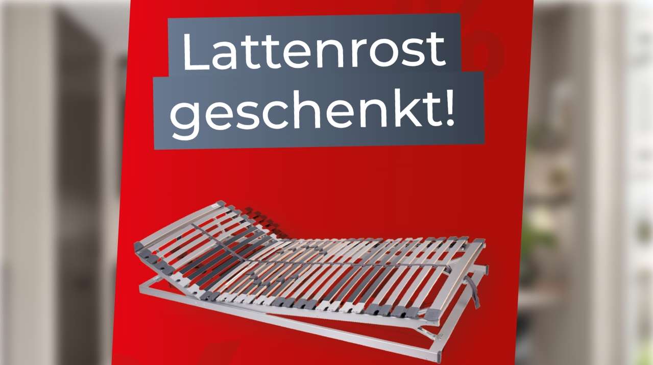 Rotes Werbeplakat mit einem Lattenrost und dem Hinweis auf einen kostenlosen Lattenrost beim Kauf.